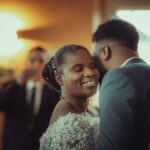 A bride and groom share a joyful moment during their wedding ceremony, captured indoors.